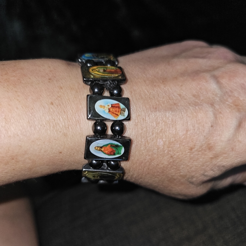 Saints elastic bracelet. Beautiful set on a metallic black stone. Catholic